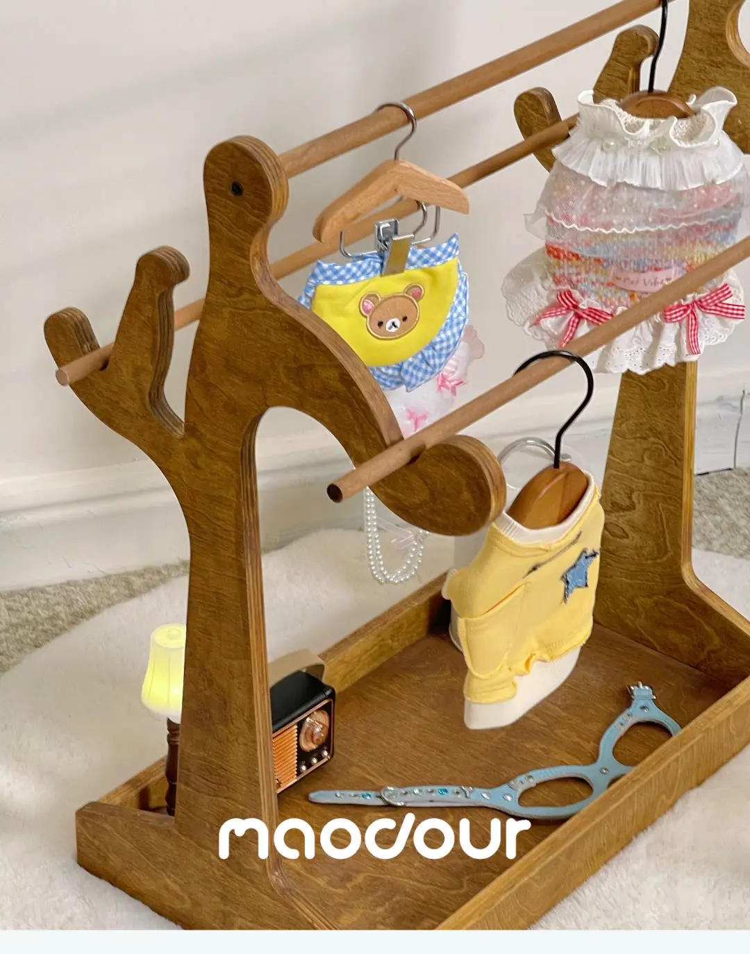 Cat and small dog clothes hanging on a portable rack